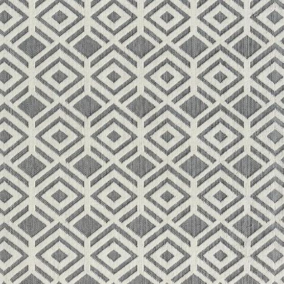 Grauer und weißer Teppich mit geometrischem Diamantmuster